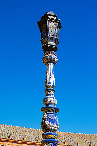 lamppost и его глиняная посуда - malaga seville cadiz andalusia стоковые фото и изображения