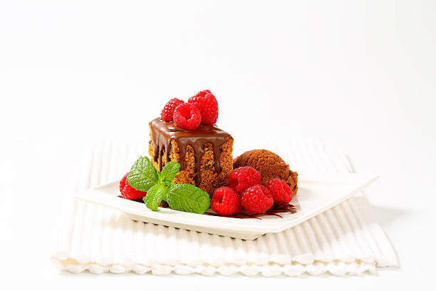 istock gingerbread cake, ice cream and raspberries 450152231