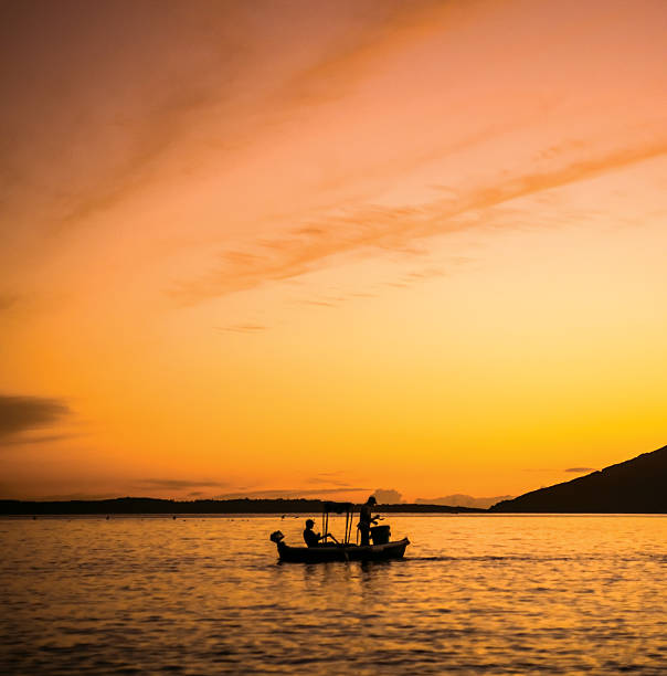 Fishermans at the small boat pulling out long line. They are fishing for Common Dentex (lat: