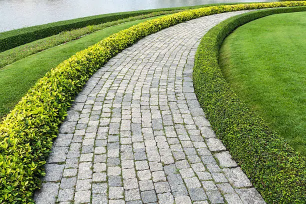 Photo of The Stone block walk path with green grass