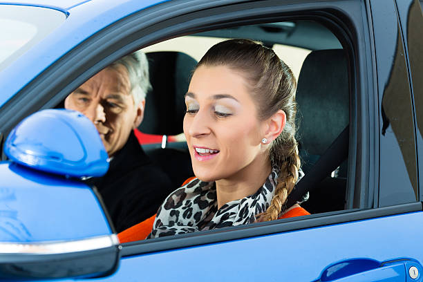 Young woman at driving lesson