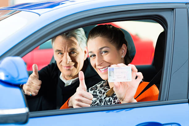 Young woman at driving lesson