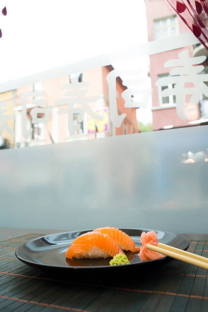 Sushi in sushi bar. Table and ration sushi with salmon