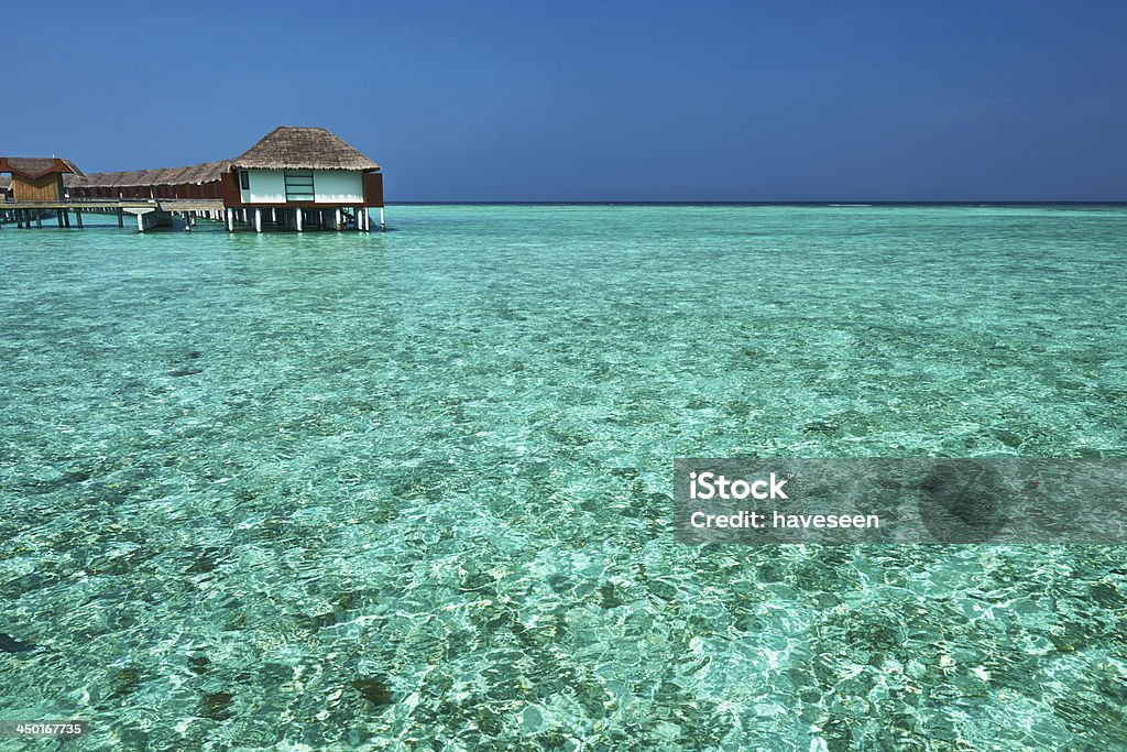 Beautiful beach with water bungalows Beautiful beach with water bungalows at Maldives Beach Stock Photo