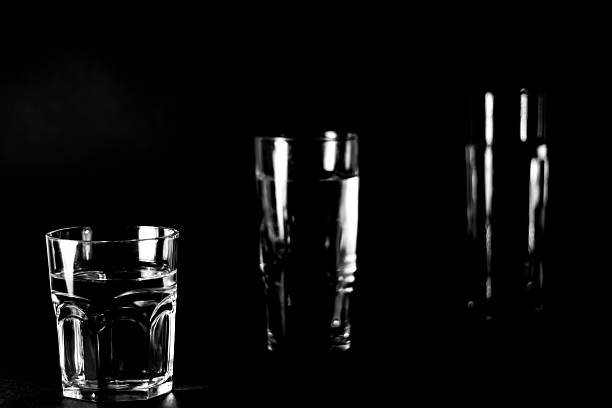 istock Cups of water in the dark 450188527