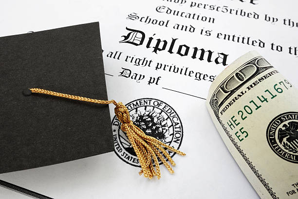 istock diploma and cash 450207169