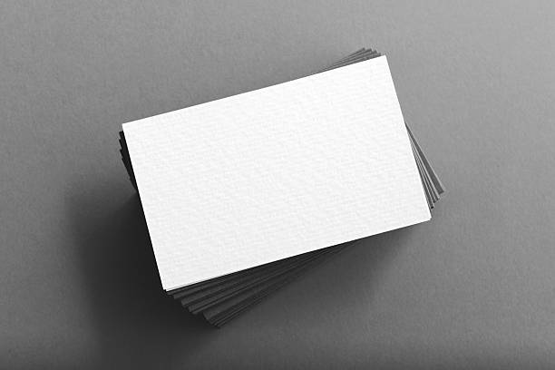 Pile of blank business cards on table