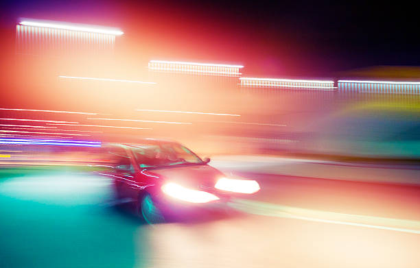 istock Speeding car at night in the city 450210851