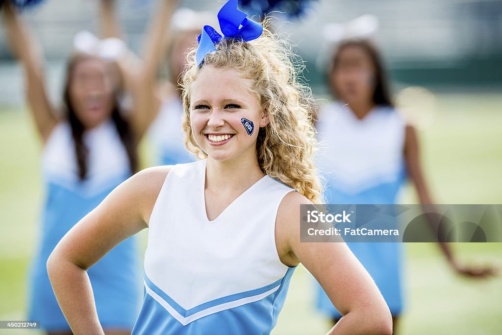 High school cheerleaders High school cheerleaders on the football field 18-19 Years Stock Photo