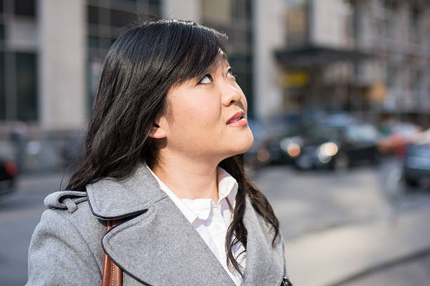 istock Woman on busy street 450213973