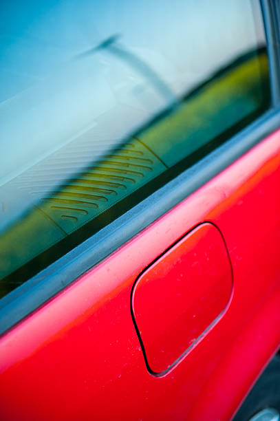 istock red car stands next to the field 450221607