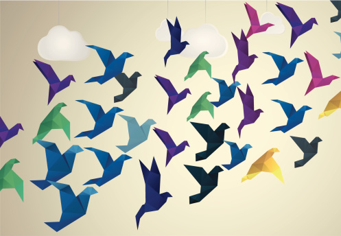 Origami Birds flying and fake clouds background