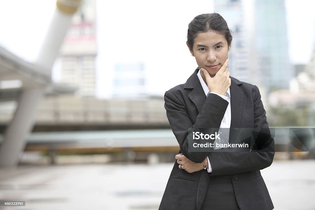 Young business woman thinking something Photo of young business woman thinking something Adult Stock Photo