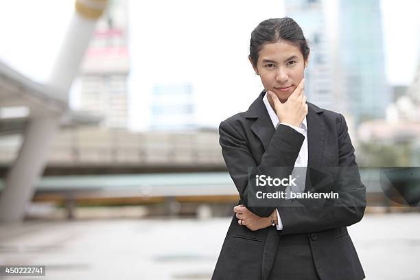 Young Business Woman Thinking Something Stock Photo - Download Image Now - Adult, Adults Only, Brown Hair