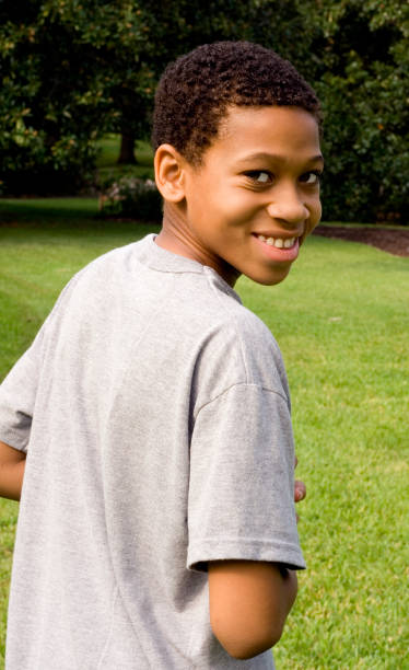 istock Young black child smiling in gray shirt 450226485