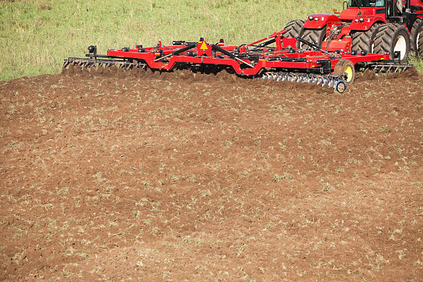 istock Tractor Towed Plow Turning Up Field 450226963