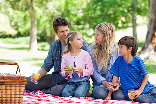 istock Family enjoying some juice and fruit together 450227051