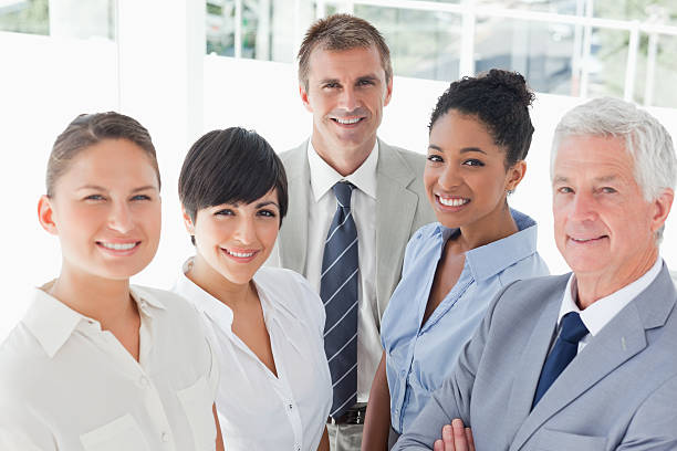 istock Smiling business team standing together 450227915