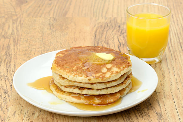istock Pancakes with butter and maple syrup 450228787