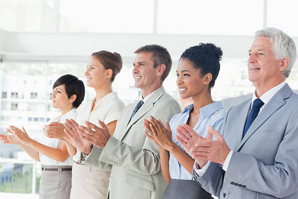 istock Applauding Business team standing in a line 450228937