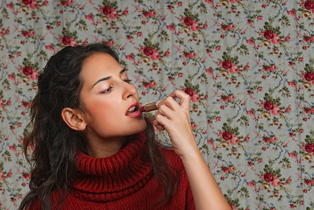 istock Woman with lipstick, floral background 450231841