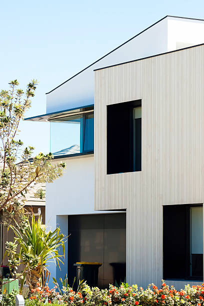 istock New modern house with garden against blue sky, copy space 450234011