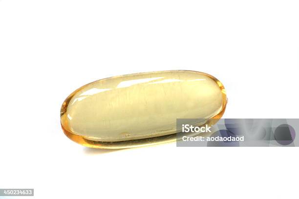 Glimmering Fish Oil Capsule Isolated On White Stock Photo - Download Image Now - Alternative Therapy, Capsule - Medicine, Close-up