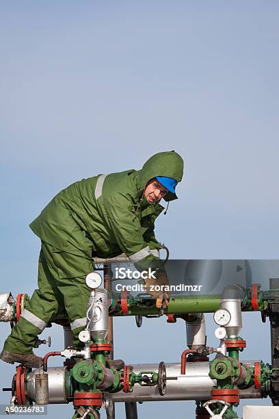 Gas Production Operator Stock Photo - Download Image Now - Adult, Adults Only, Bib Overalls