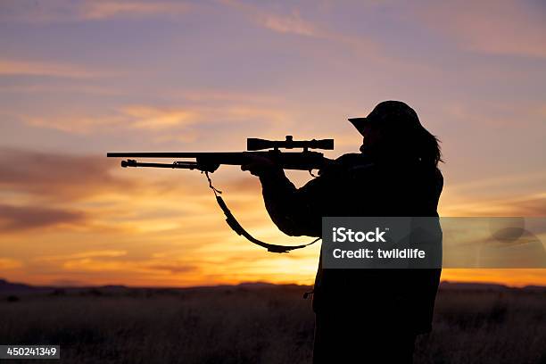 Woman Hunter Shooting At Sunset Stock Photo - Download Image Now - Hunting - Sport, Hunter, Rifle