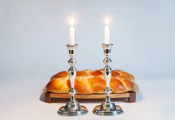 Challah and candles for the Jewish Sabbath.