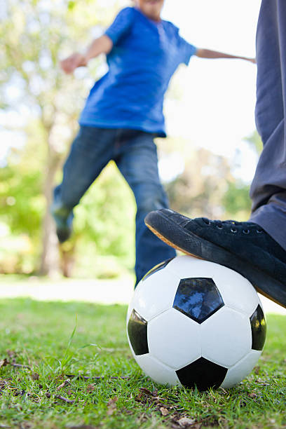istock Boy just about to kick a football 450243803