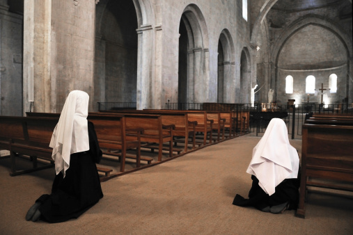 Nuns are praying in a church
