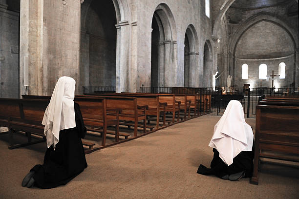 Nun in a church Nuns are praying in a church nun catholicism sister praying stock pictures, royalty-free photos & images