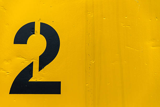istock Number 2 on side of yellow metal train car 450249897