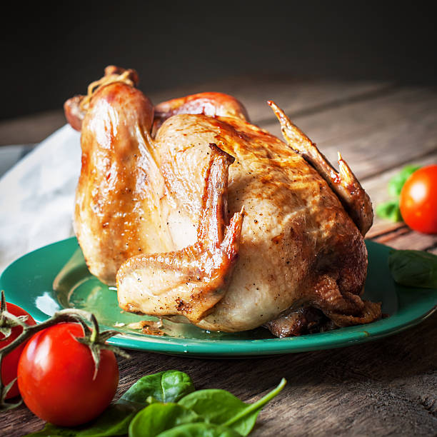 istock Baked Whole Chicken with vegetables, square image 450250283