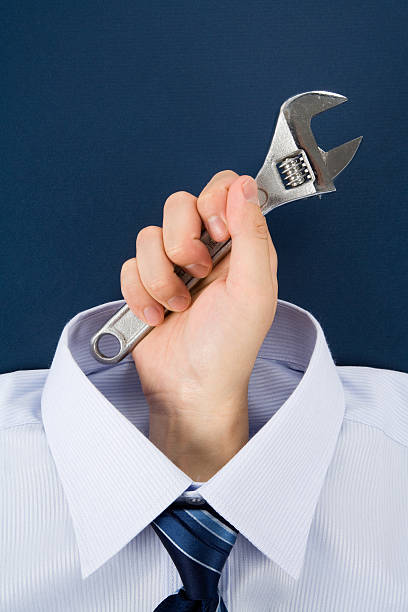 istock hand holding Wrench 450251551