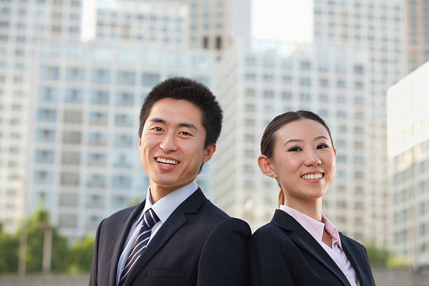 istock Two young business people outside 450253219