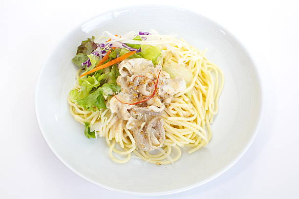 istock spaghetti pasta with green salad 450253489