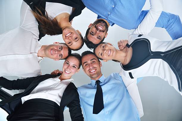 istock business people group joining hands 450256575