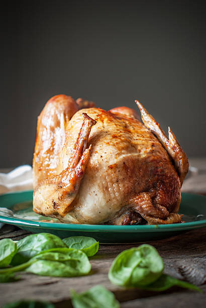istock Roast Chicken on the Wooden Table, dark background 450263253