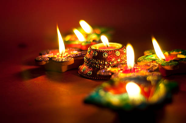 Diwali oil lamps lit up at night Lights diya oil lamp stock pictures, royalty-free photos & images