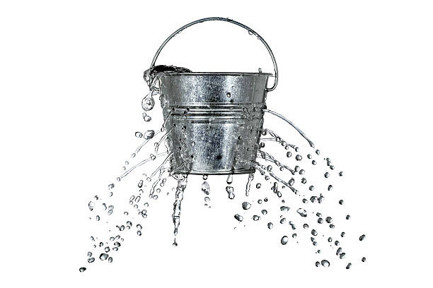 bucket with holes water is coming out of a bucket with holes water crisis stock pictures, royalty-free photos & images