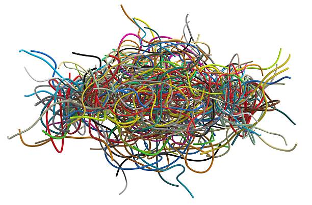 istock Close-up of tangled colorful cables on white background 450269531