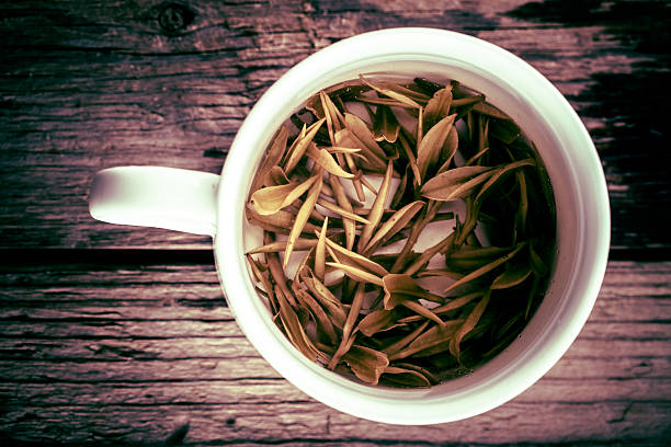 istock green tea in white china cup 450271891