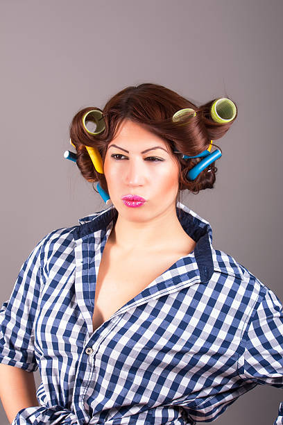 istock attractive girl with curlers 450273547