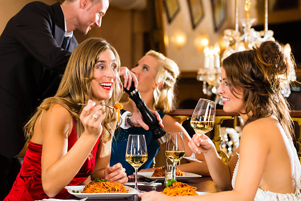 istock Waiter spices the dinner in a fine restaurant 450275507