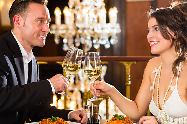istock happy couple have a romantic date in restaurant 450275533