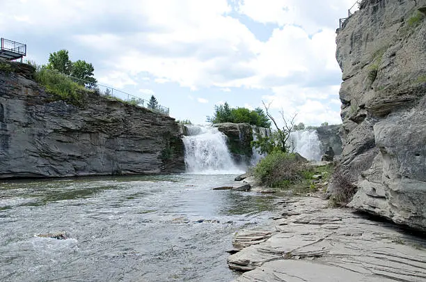 View of Lundbreck Falls from the level of Oldman River on a summer day.