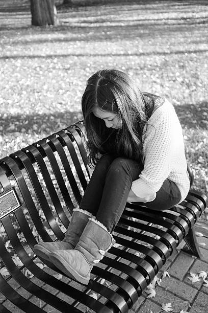 istock Woman sitting on bench 450279171