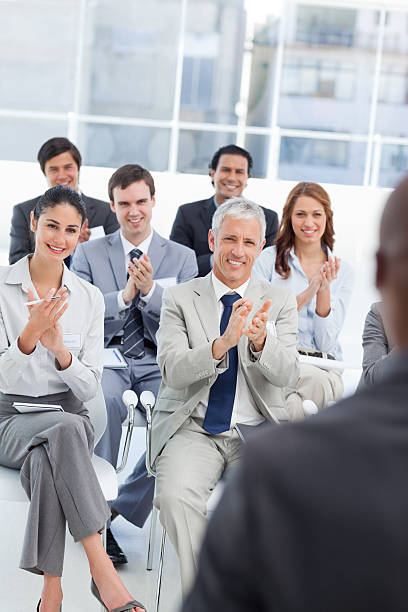 istock Business team applauding watching their colleague 450292247
